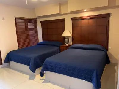 Cama o camas de una habitación en Suites Posada Obregon