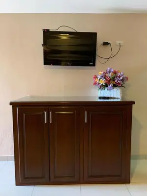 Una televisión o centro de entretenimiento en Suites Posada Obregon