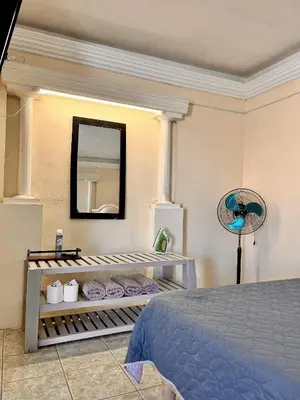 Cama o camas de una habitación en Habitaciónes Las Palmeras