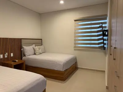 Cama o camas de una habitación en A Pie de Playa, Con Hermosas Vistas al Oceano