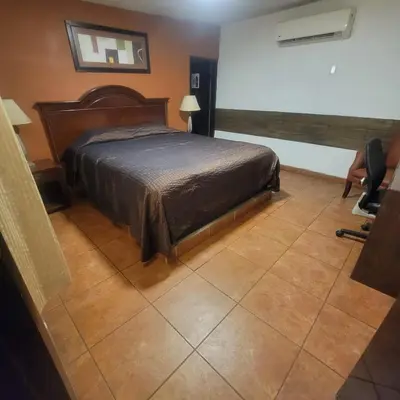 Cama o camas de una habitación en hotel villa del sol chihuahua