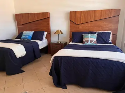 Cama o camas de una habitación en Casa Playa San Carlos