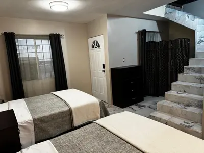 Cama o camas de una habitación en Depto para 5 cerca de aeropuerto Cocina amplia AC