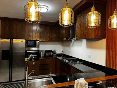 Una cocina o zona de cocina en Depto para 5 cerca de aeropuerto Cocina amplia AC