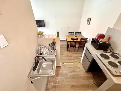 Una cocina o zona de cocina en Habitacion olas altas