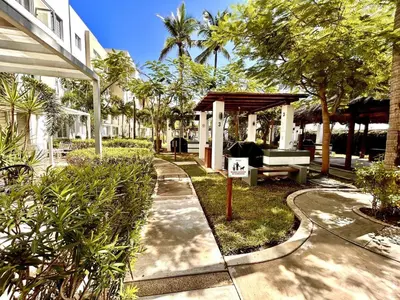 Jardín al aire libre en Almar Departamento con alberca cerca de la playa