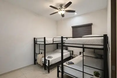 Cama o camas de una habitación en 24k Propiedades Premium Condo on Malecon with Ocean View Sleeps 6