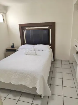 Cama o camas de una habitación en Casa céntrica con estacionamiento para 5 huéspedes