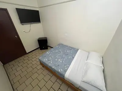 Cama o camas de una habitación en Hotel Kataluma