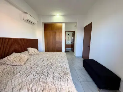 Cama o camas de una habitación en DEPA NUEVO en TORRE CORDOBA a pasos del MALECON y PLAYA