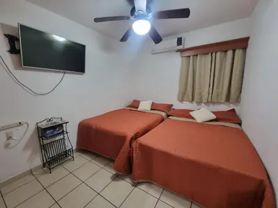 Cama o camas de una habitación en Ideal location! Apartment 2 blocks from the Malecón