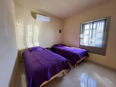 Cama o camas de una habitación en Depa Familiar