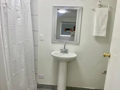 Un baño de Casa 11 Centrica 3 camas queen