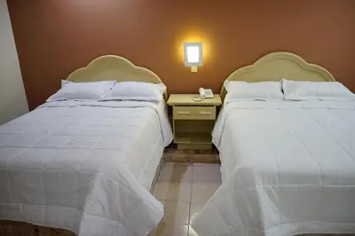 Cama o camas de una habitación en Hotel Posada del Sol Inn