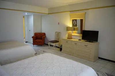 Cama o camas de una habitación en Hotel Posada del Sol Inn