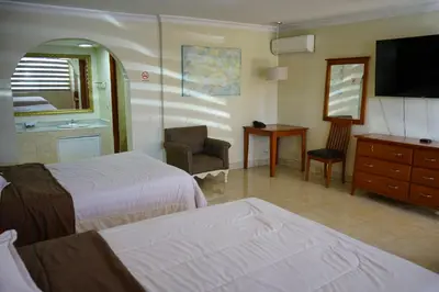 Cama o camas de una habitación en Hotel Posada del Sol Inn