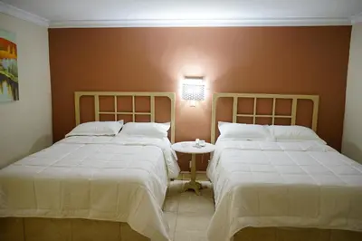 Cama o camas de una habitación en Hotel Posada del Sol Inn