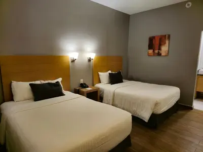 Cama o camas de una habitación en Bluu Hotel Aeropuerto Monclova-Frontera
