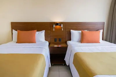 Cama o camas de una habitación en Gamma Mazatlan The Inn At Centro Historico