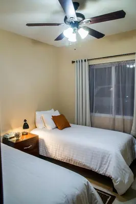 Cama o camas de una habitación en Bugambilias Suites