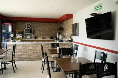 Una televisión o centro de entretenimiento en Apple Inn