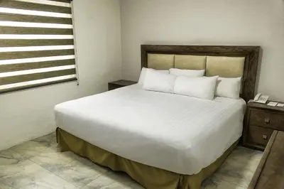 Cama o camas de una habitación en Hotel Adriana
