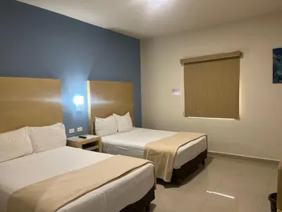 Cama o camas de una habitación en Capital Hotel