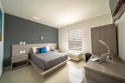 Cama o camas de una habitación en Hotel Nuve Torreón