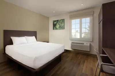 Cama o camas de una habitación en Extended Suites Ciudad Juarez Consulado