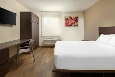 Cama o camas de una habitación en Extended Suites Ciudad Juarez Consulado