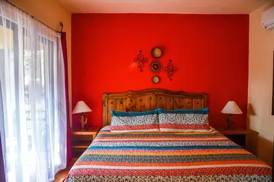 Cama o camas de una habitación en Hotel Casa Mangos Loreto