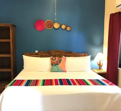 Cama o camas de una habitación en Hotel Casa Mangos Loreto