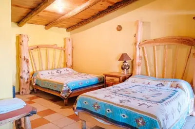 Cama o camas de una habitación en Cabañas Margarito
