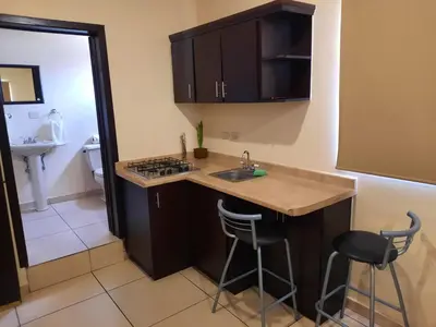 Una cocina o zona de cocina en Hgen Rooms & Suites