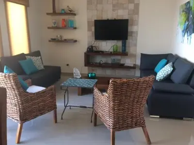 Una televisión o centro de entretenimiento en Departamento de Lujo en Mazatlan