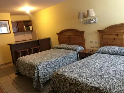 Cama o camas de una habitación en Aparthotel - El Ejecutivo