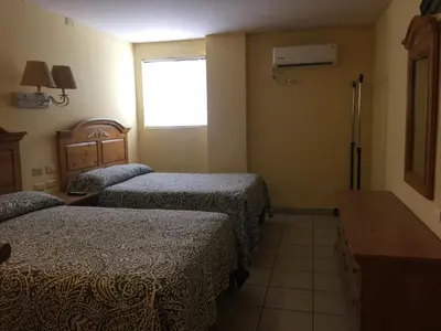 Cama o camas de una habitación en Aparthotel - El Ejecutivo