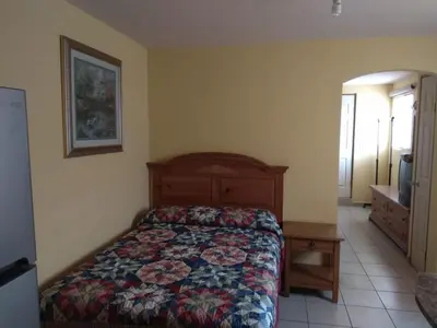 Cama o camas de una habitación en Aparthotel - El Ejecutivo