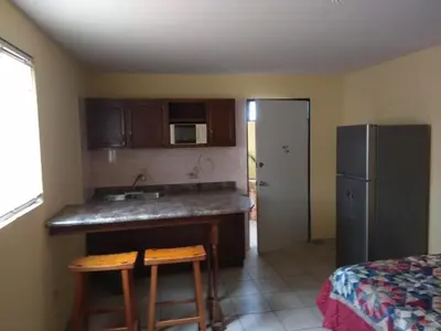 Una cocina o zona de cocina en Aparthotel - El Ejecutivo
