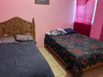 Cama o camas de una habitación en Blanquita Apartment