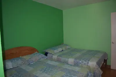 Cama o camas de una habitación en Blanquita guesthouse
