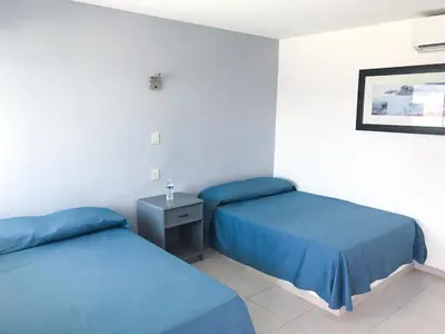 Cama o camas de una habitación en Mona Inn