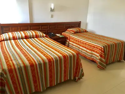 Cama o camas de una habitación en Hotel del Valle