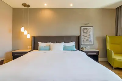 Cama o camas de una habitación en Hotel Lucerna Hermosillo