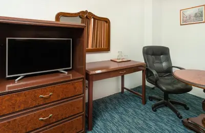 Una televisión o centro de entretenimiento en Hotel San Jorge