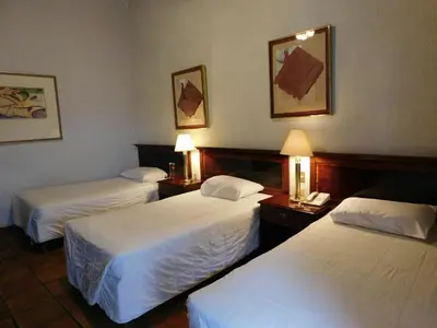 Cama o camas de una habitación en Hotel Urdiñola Saltillo