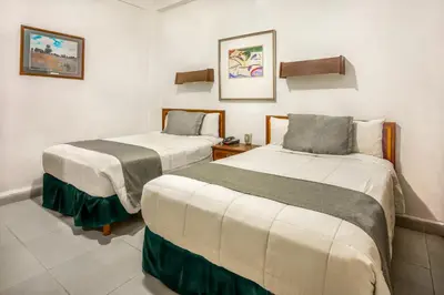 Cama o camas de una habitación en Hotel Premier Saltillo Coahuila