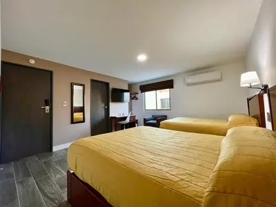 Cama o camas de una habitación en Neo Business Hotel