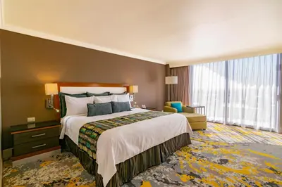 Cama o camas de una habitación en Hotel Lucerna Ciudad Juarez