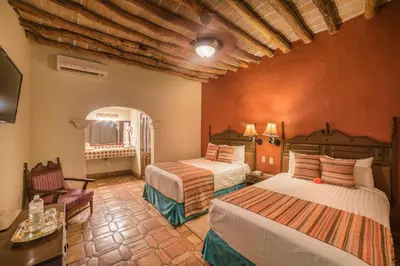 Cama o camas de una habitación en Hotel Posada del Hidalgo - Balderrama Hotel Collection